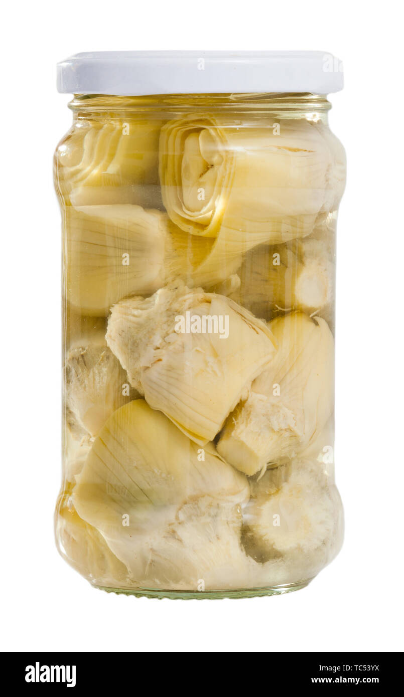 Marinated artichokes in glass jar. Isolated over white background Stock