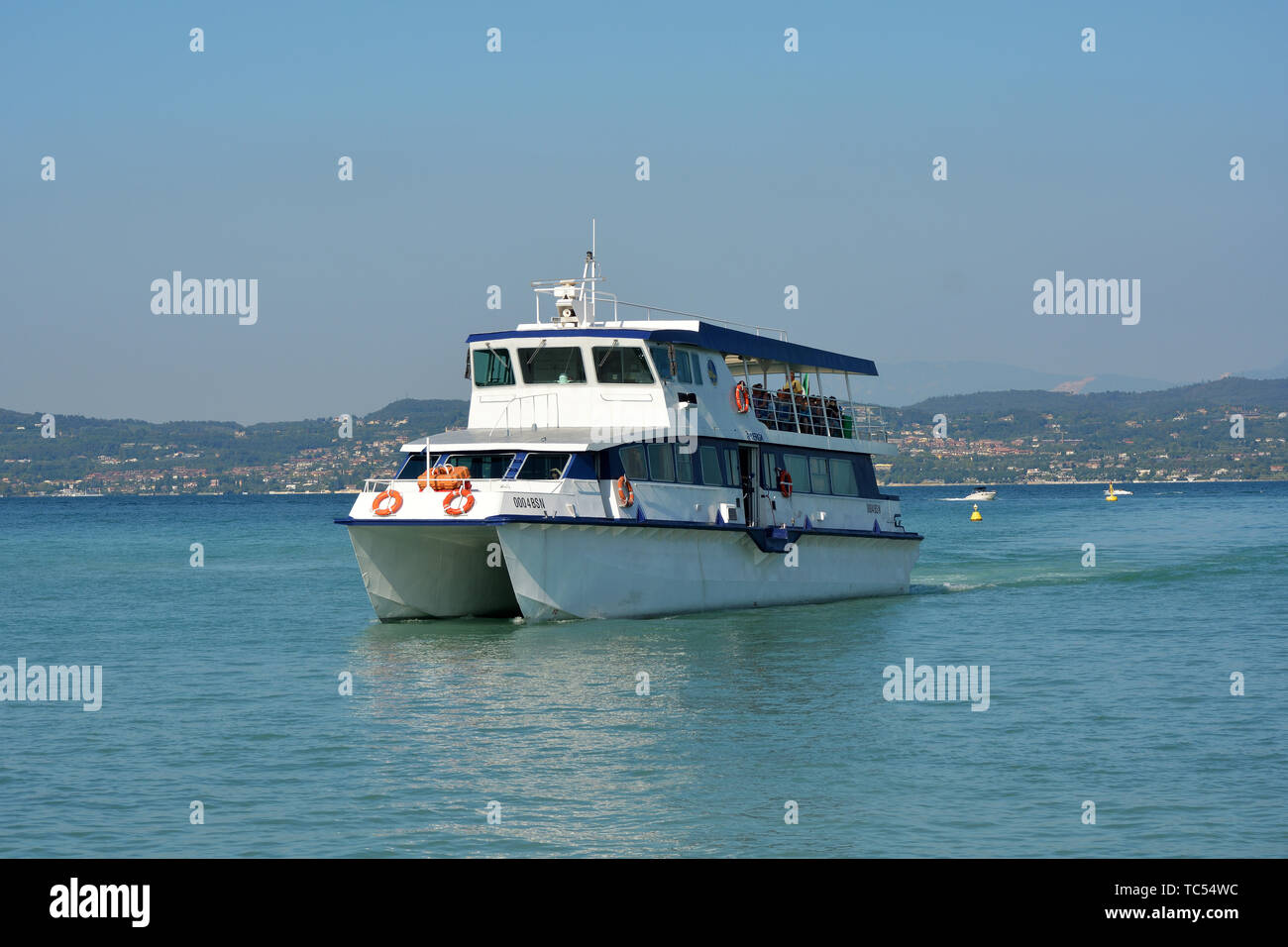Passenger ship on the way to Desenzano del Garda on Lake Garda - Italy. Stock Photo