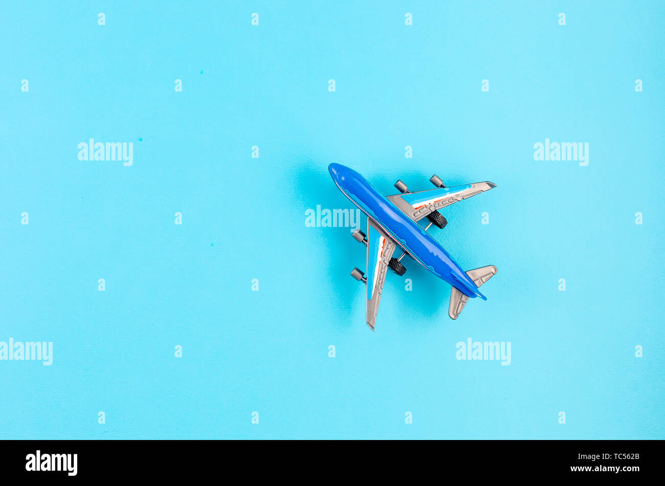 Top view of toy Airplane model on blue background, picture for add text  message or used background, website, travel and tour background Trip  Concept Stock Photo - Alamy