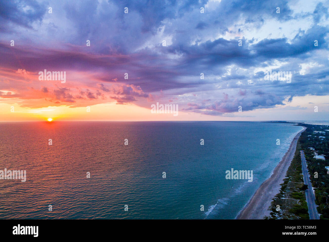 Captiva Island Florida,Gulf of Mexico beach beaches sunset clouds water sky,aerial overhead bird's eye view above,visitors travel traveling tour touri Stock Photo