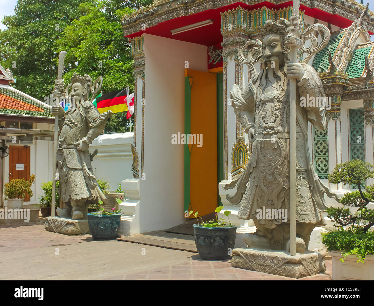 Chinese stone guardians statue at Wat Phra Kaew, Temple of the Emerald Buddha, Grand Palace, Bangkok, Thailand. Stock Photo