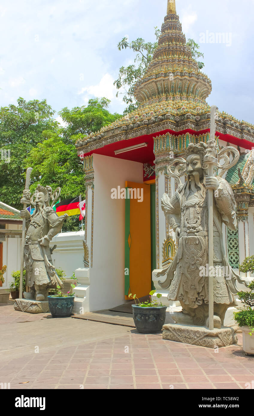 Chinese stone guardians statue at Wat Phra Kaew, Temple of the Emerald Buddha, Grand Palace, Bangkok, Thailand. Stock Photo