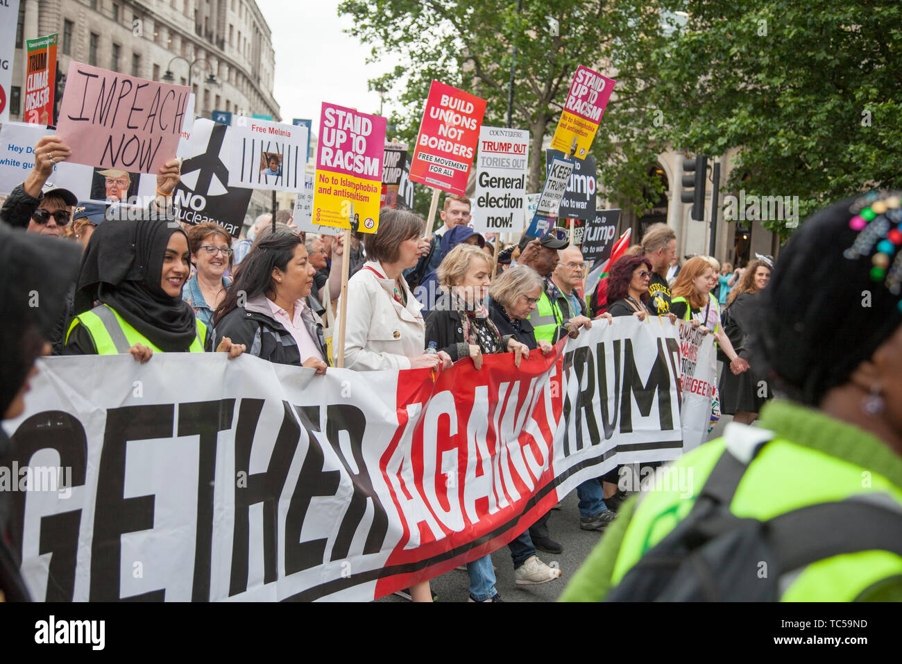 LONDON, UK - June 4th 2019: Large crowds of protesters gather in central London to demonstrate against President Trump's state visit to the UK Stock Photo