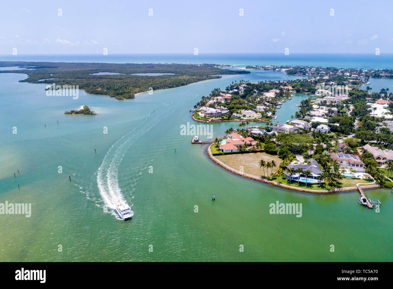 Naples Florida,Port Royal,Gordon River Pass Gulf of Mexico,Double Sunshine Sightseeing Cruise boat,estates mansions homes,aerial overhead view,FL19051 Stock Photo