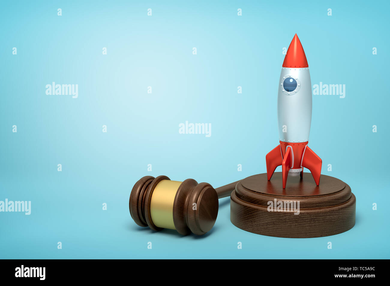 3d rendering of silver red space rocket on round wooden block and brown wooden gavel on blue background Stock Photo