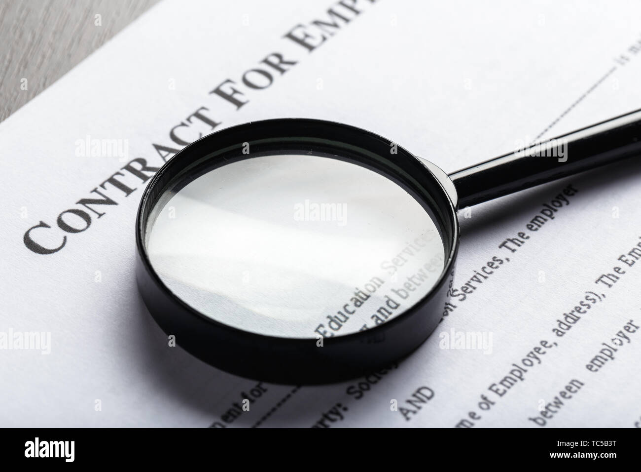 Magnifying Glass and document close up Stock Photo