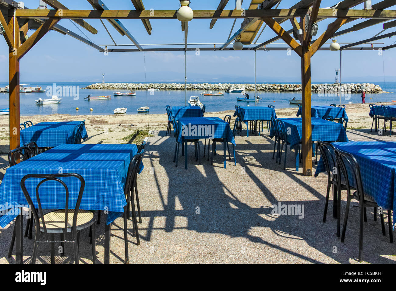 NEA FOKEA, KASSANDRA,  GREECE - MARCH 31, 2019: Typical Greek restaurant at the beach of Nea Fokea, Kassandra, Chalkidiki, Central Macedonia, Greece Stock Photo
