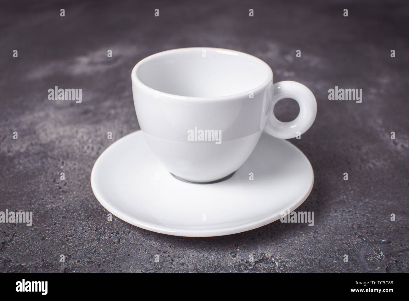 Empty White Espresso Coffee Cup on Dark Background Stock Photo