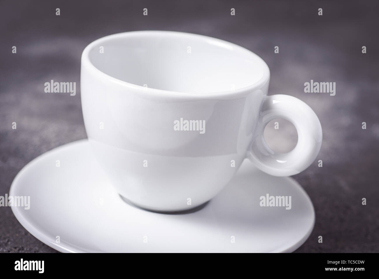 Empty White Espresso Coffee Cup on Dark Background Stock Photo