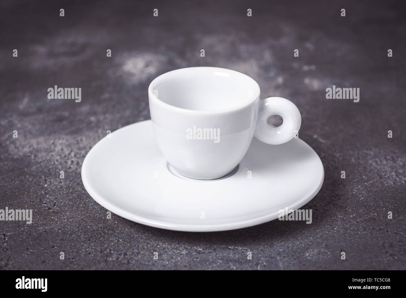 Empty White Espresso Coffee Cup on Dark Background Stock Photo