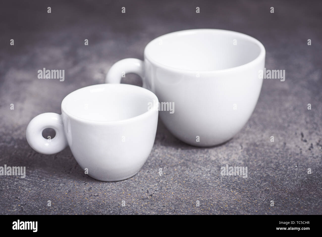 Empty White Espresso Coffee Cup on Dark Background Stock Photo
