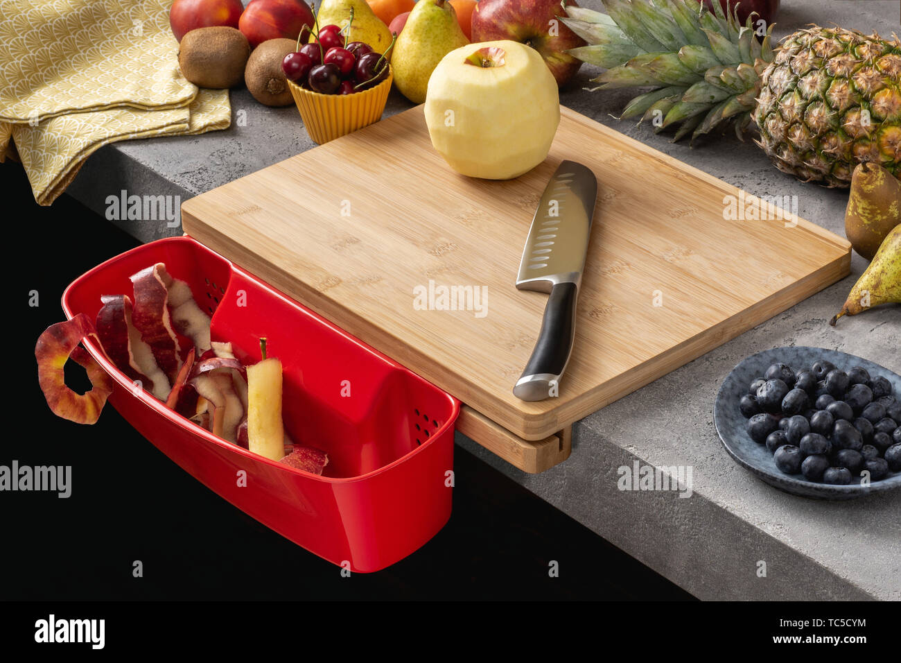 Wood Cutting Board with Waste Container, Santoku Chef Knife and Fresh Fruits. Healthy Eating Concept. Stock Photo