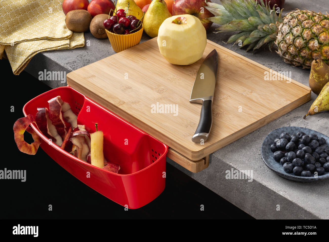 Wood Cutting Board with Waste Container, Santoku Chef Knife and Fresh Fruits. Healthy Eating Concept. Stock Photo