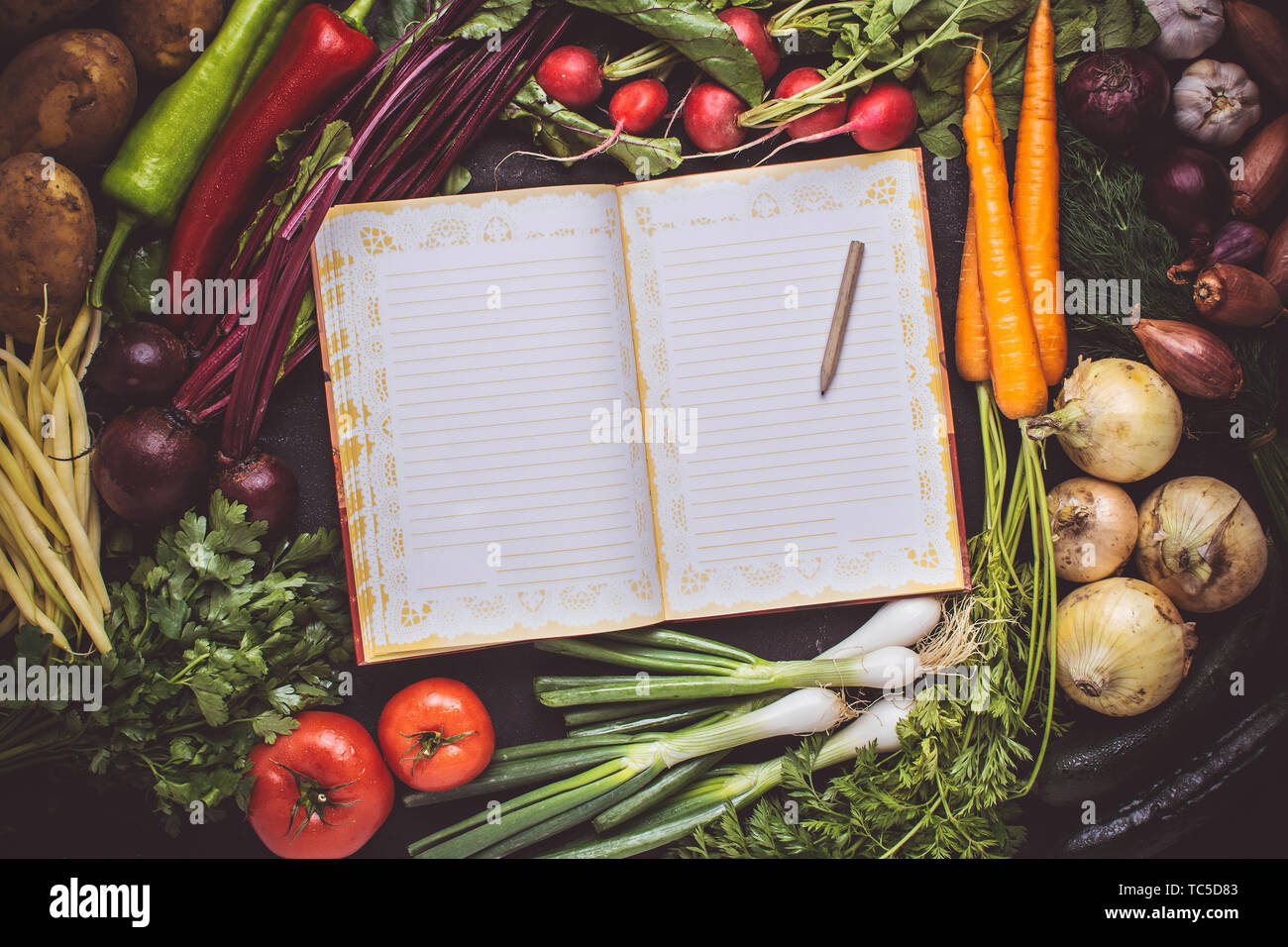 Blank Recipe Empty Cook Book Mockup with Fresh Vegetables. Vegan Raw Food. Healthy Eating Concept with Copy Space. Stock Photo