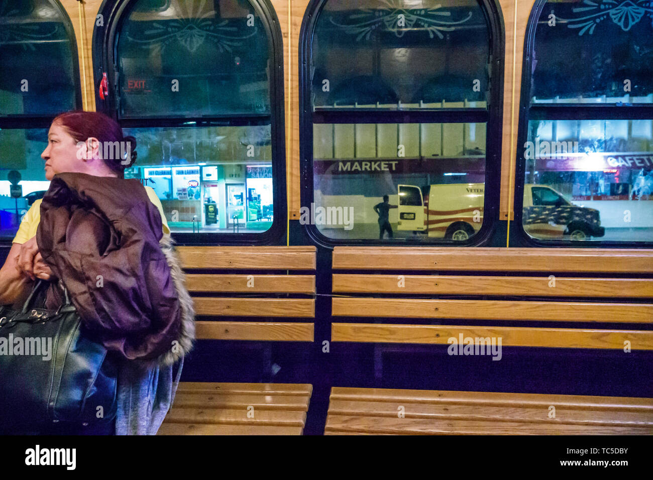 Miami Beach Florida,Normandy Isle,North Beach Loop free trolley bus public transportation,onboard cabin night,Hispanic Latin Latino ethnic immigrant i Stock Photo