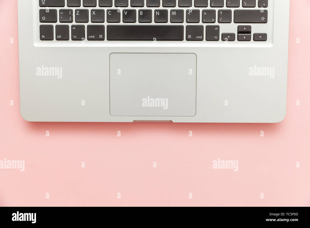 Keyboard laptop computer isolated on pink pastel desk background ...