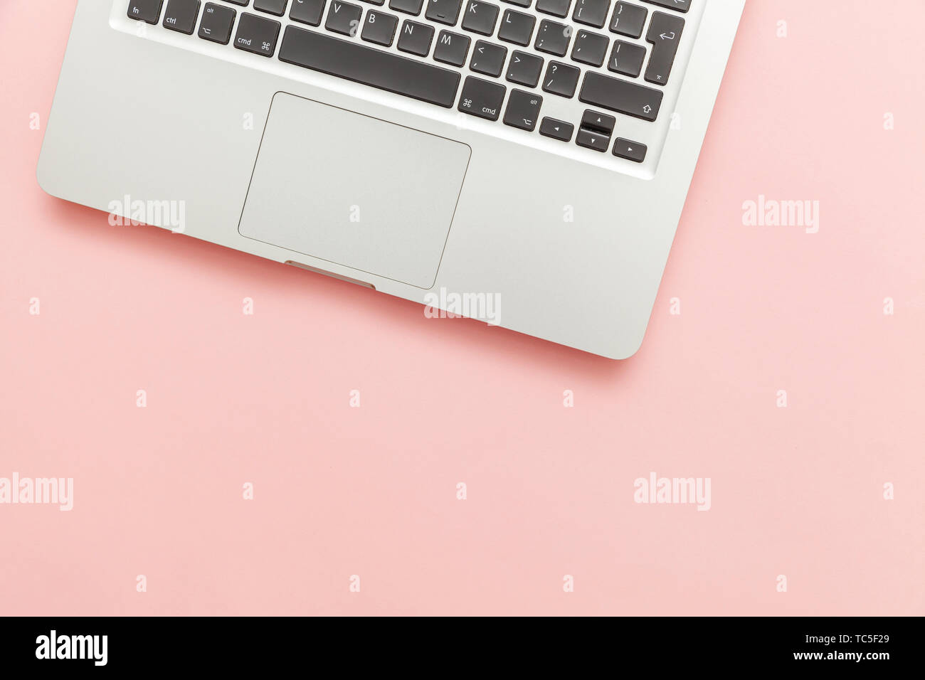 Keyboard laptop computer isolated on pink pastel desk background ...
