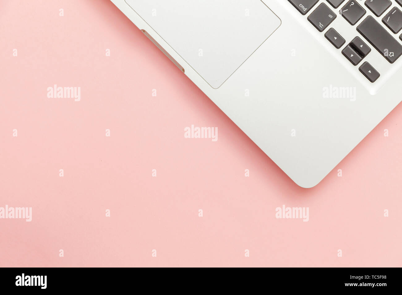 Keyboard laptop computer isolated on pink pastel desk background ...