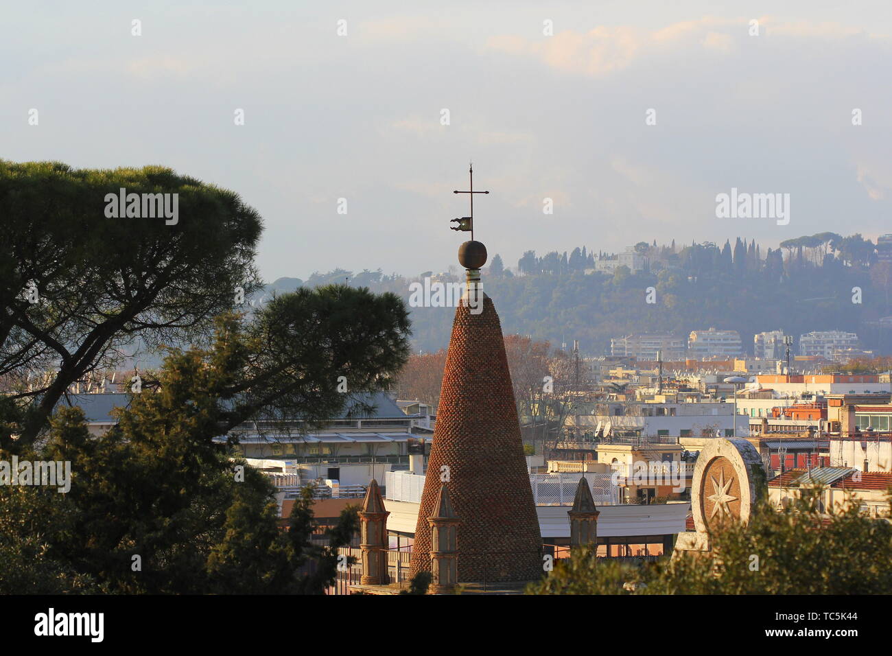 Cityscape of Rome, Italy, a view with tower clock of Basilica of Santa Maria del Popolo Stock Photo