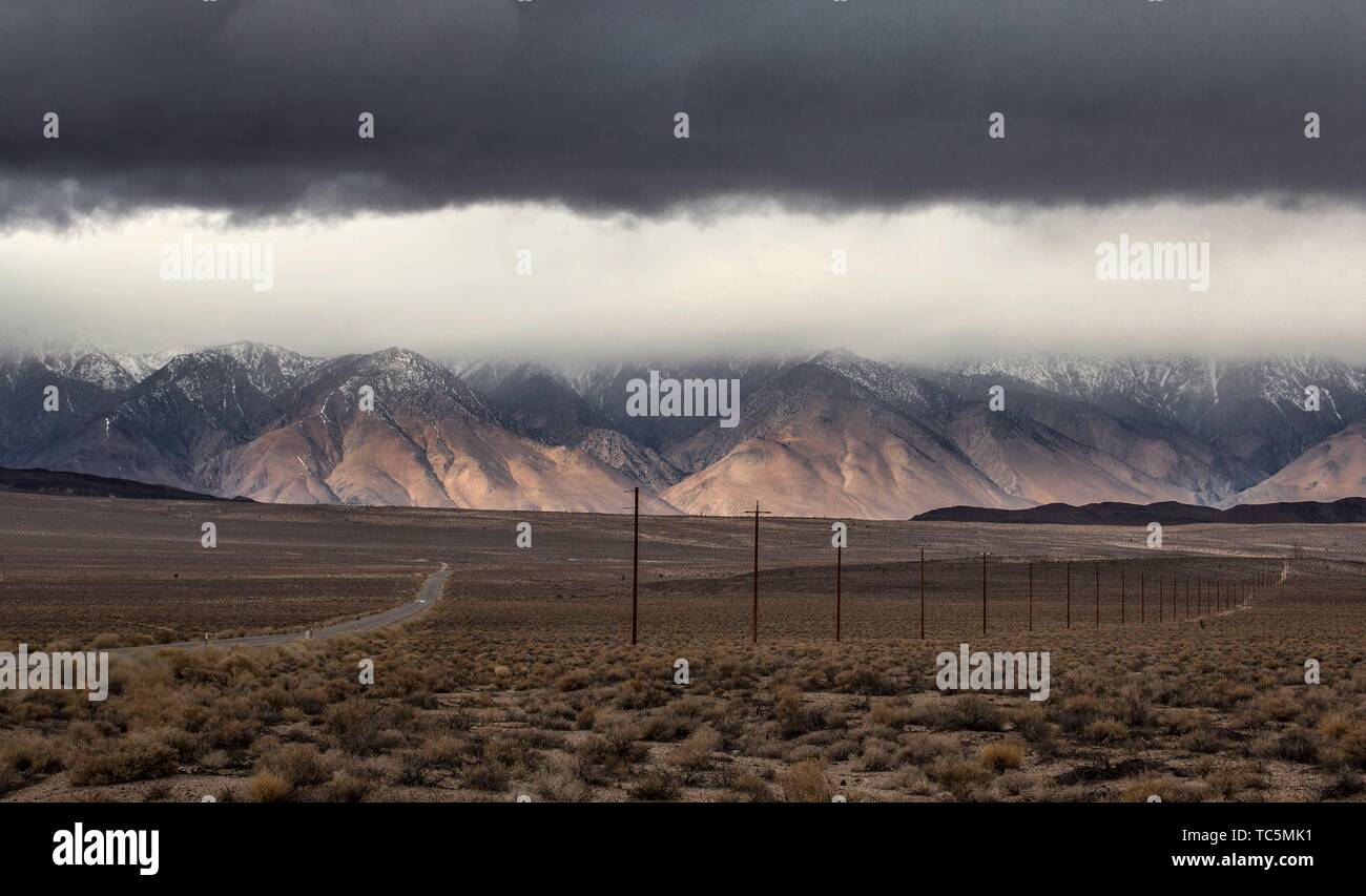 The snow-covered Sierra Nevada Mountains are the predominate feature at Owens Valley, California. Stock Photo