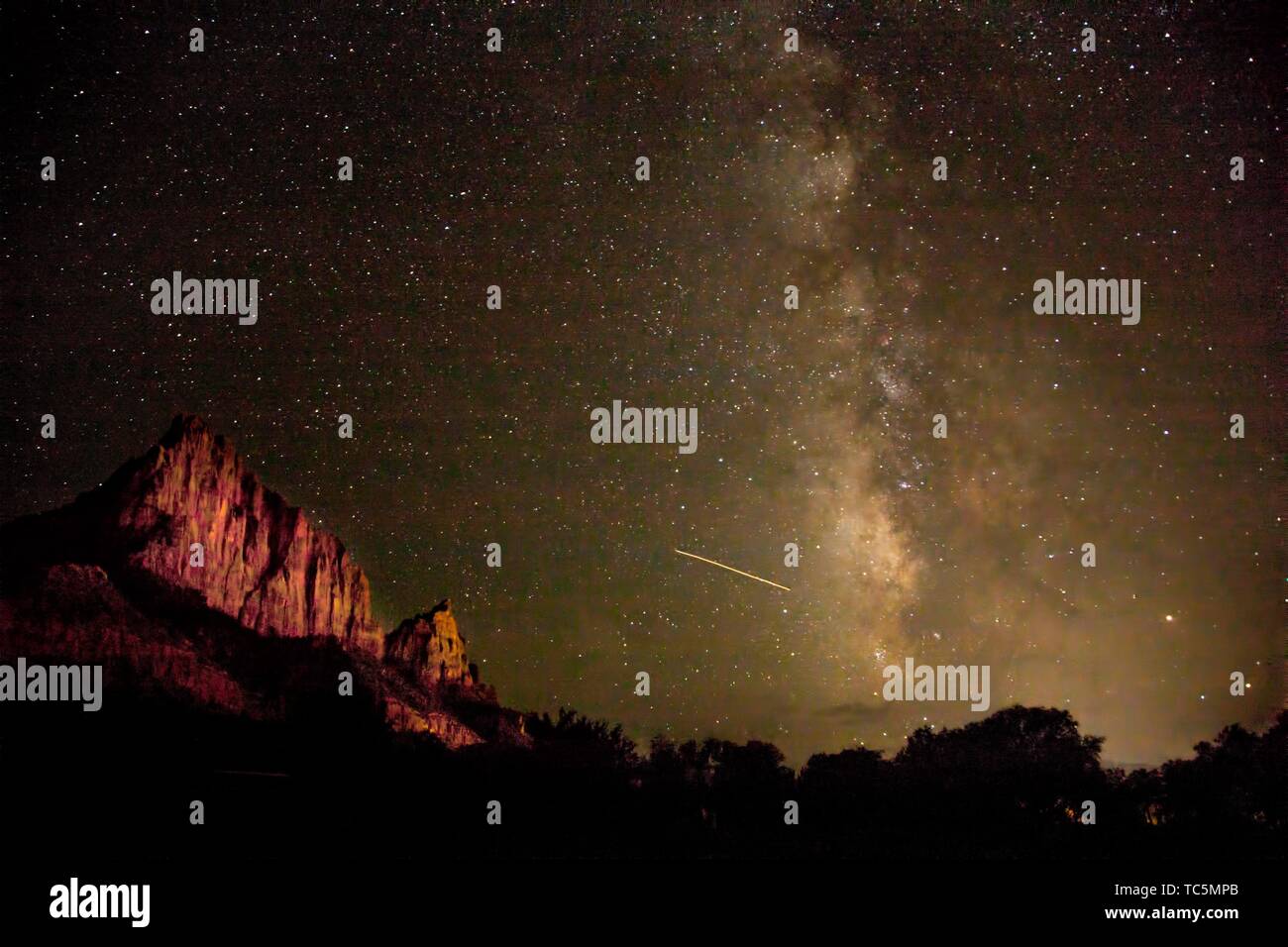 The Milky Way appears over Zion National Park on a moonless night Stock