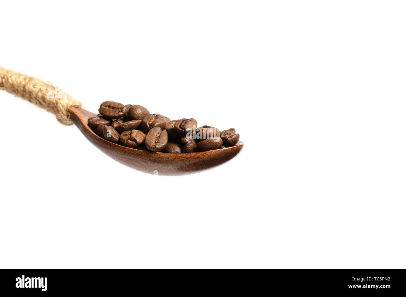 Coffee beans in wooden spoon on white background Stock Photo - Alamy