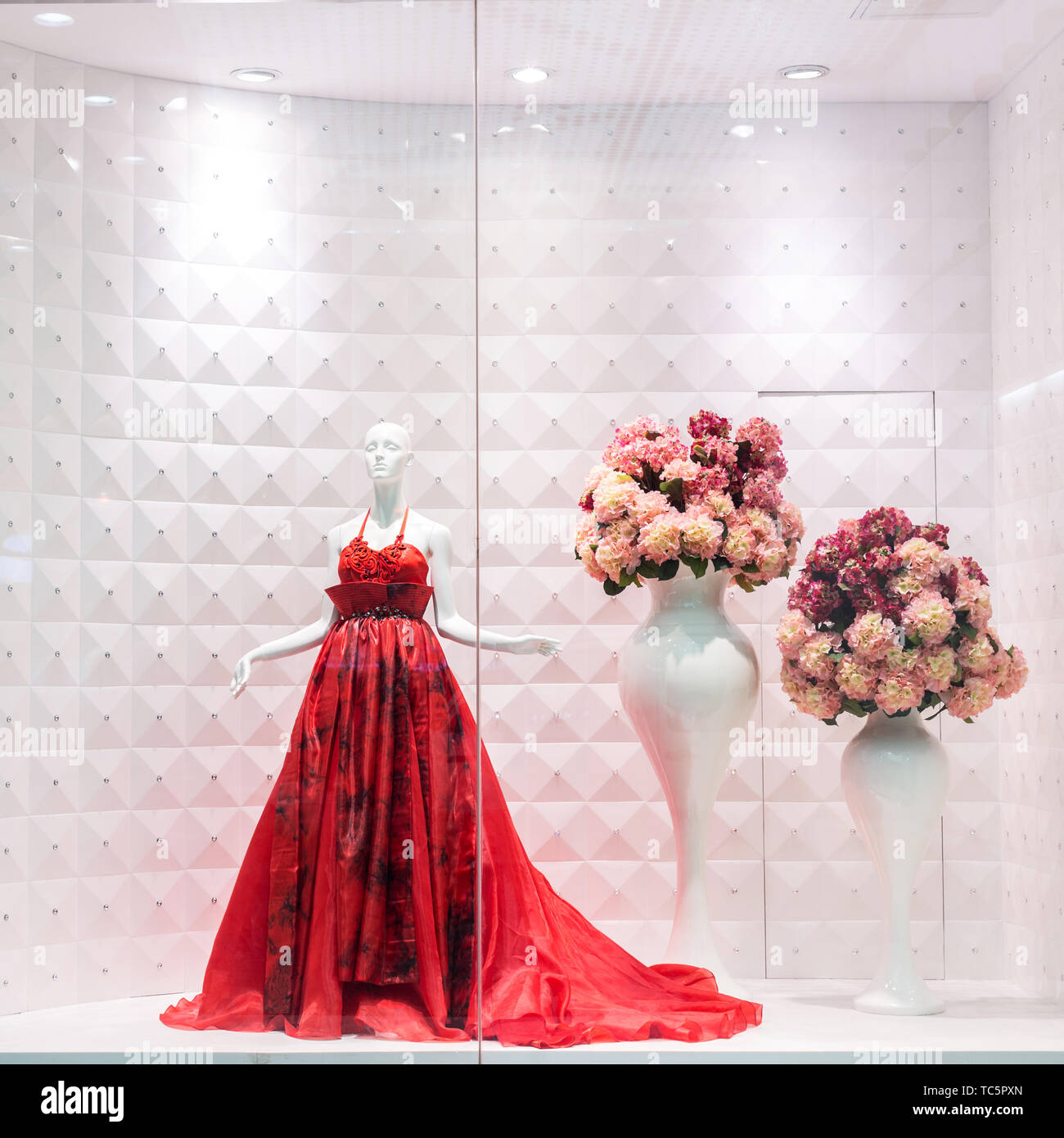 Red dress on mannequin Stock Photo - Alamy