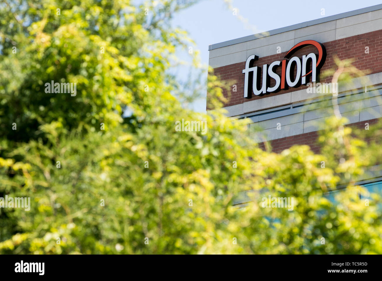 A logo sign outside of a facility occupied by Fusion Connect, Inc., in Herndon, Virginia on June 4, 2019. Stock Photo