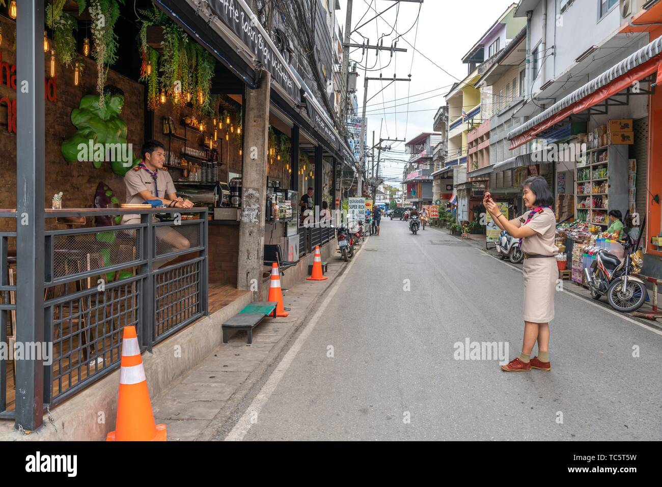 Taking a snapshot with a smartphone, Mae Sai, Northern Thailand Stock Photo