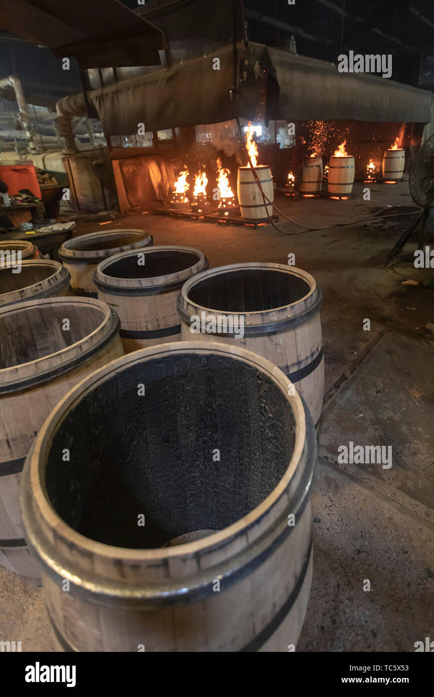 Louisville, Kentucky - Workers at Kelvin Cooperage make oak barrels for aging bourbon and wine. Barrels are charred to add flavor during the aging pro Stock Photo