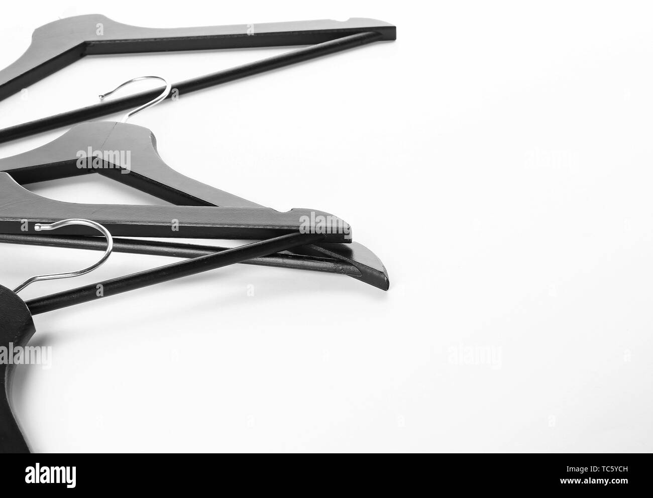 Clothes hangers on white background Stock Photo Alamy