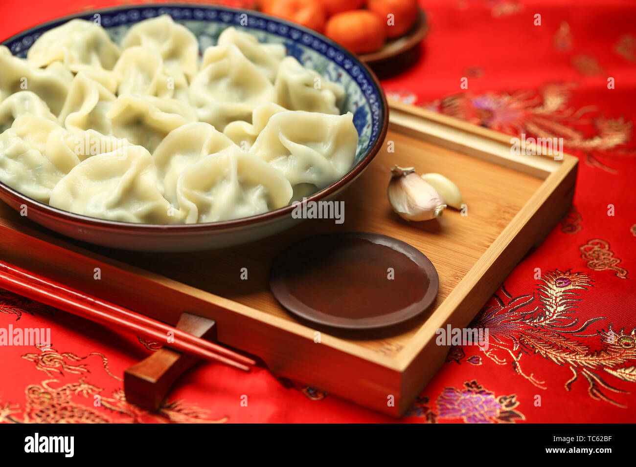 Spring Festival dumplings on red background Stock Photo - Alamy