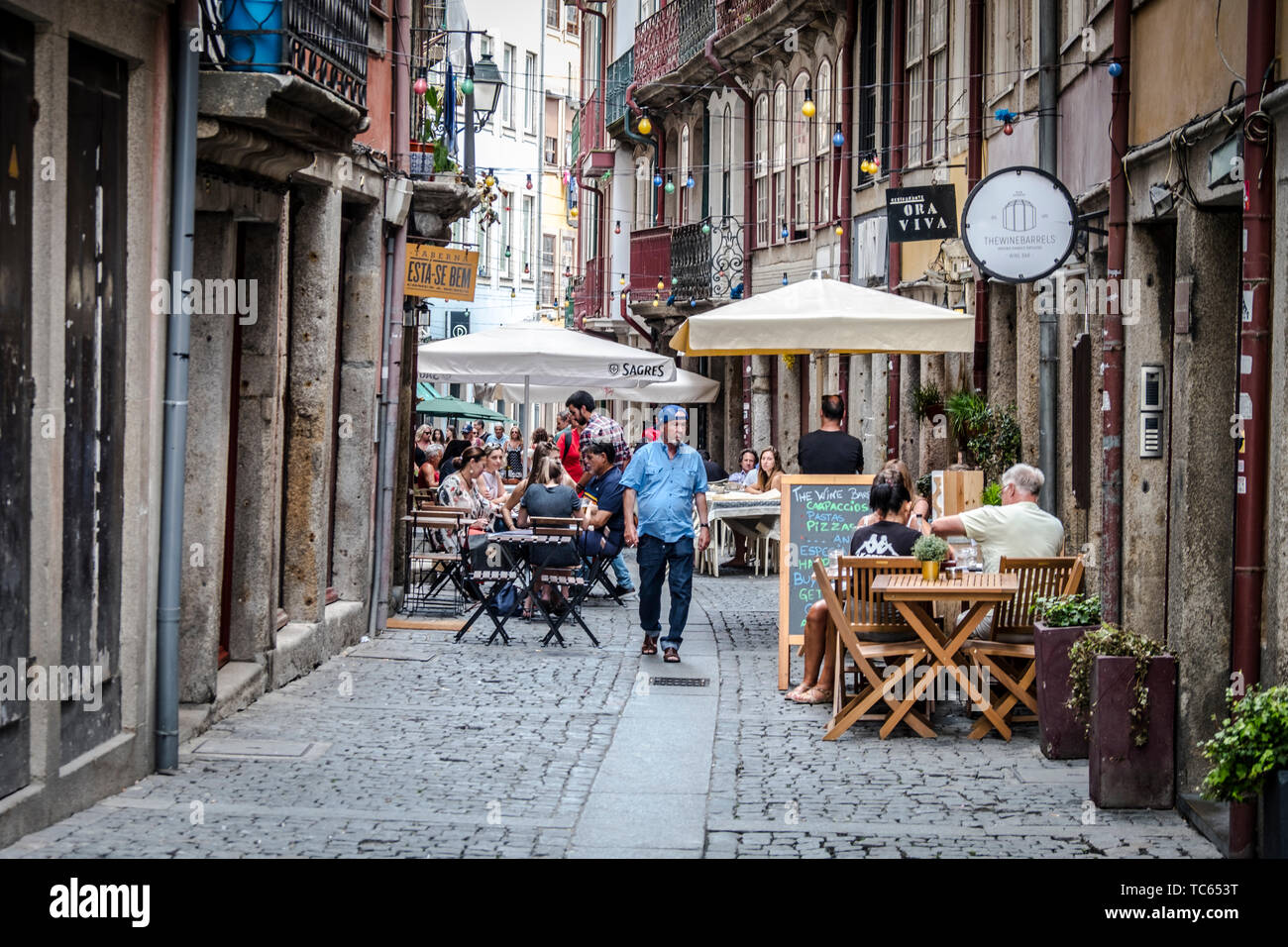 Tourists and locals walking the streets of Porto, Portugal. Porto is the  2nd largest city in Portugal. Its old town is a UNESCO World Heritage Site  Stock Photo - Alamy