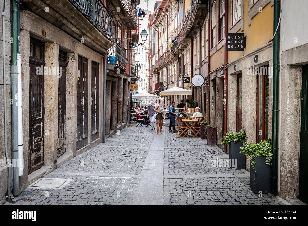 Tourists and locals walking the streets of Porto, Portugal. Porto is the  2nd largest city in Portugal. Its old town is a UNESCO World Heritage Site  Stock Photo - Alamy
