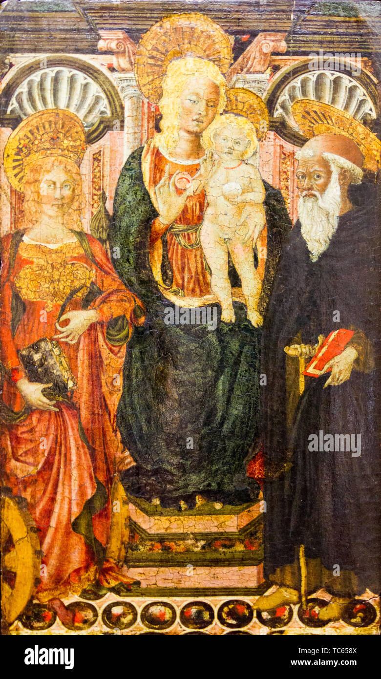 The Virgin Mary with the Infant Jesus on a throne between St. Catherine of Alexandria and St. Anthony the Abbot (the Great). Stock Photo