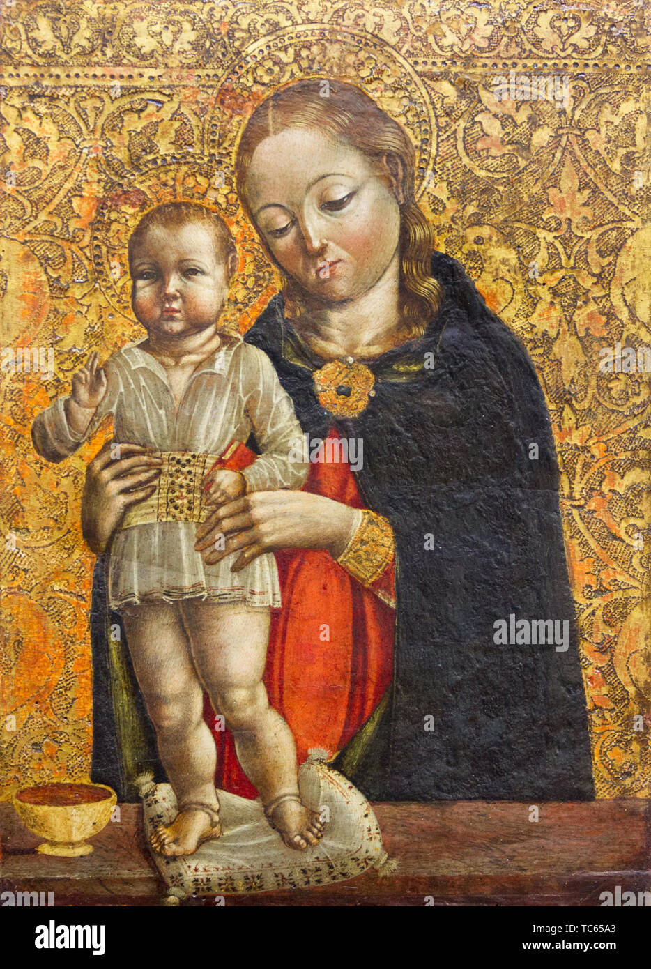 The Virgin Mary with the blessing Infant Jesus in her arms. Currently in Castello Visconteo. Stock Photo