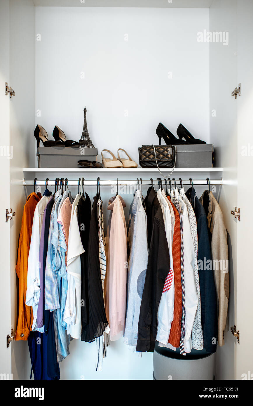 Wardrobe closet full of different clothes and female shoes indoors Stock  Photo - Alamy