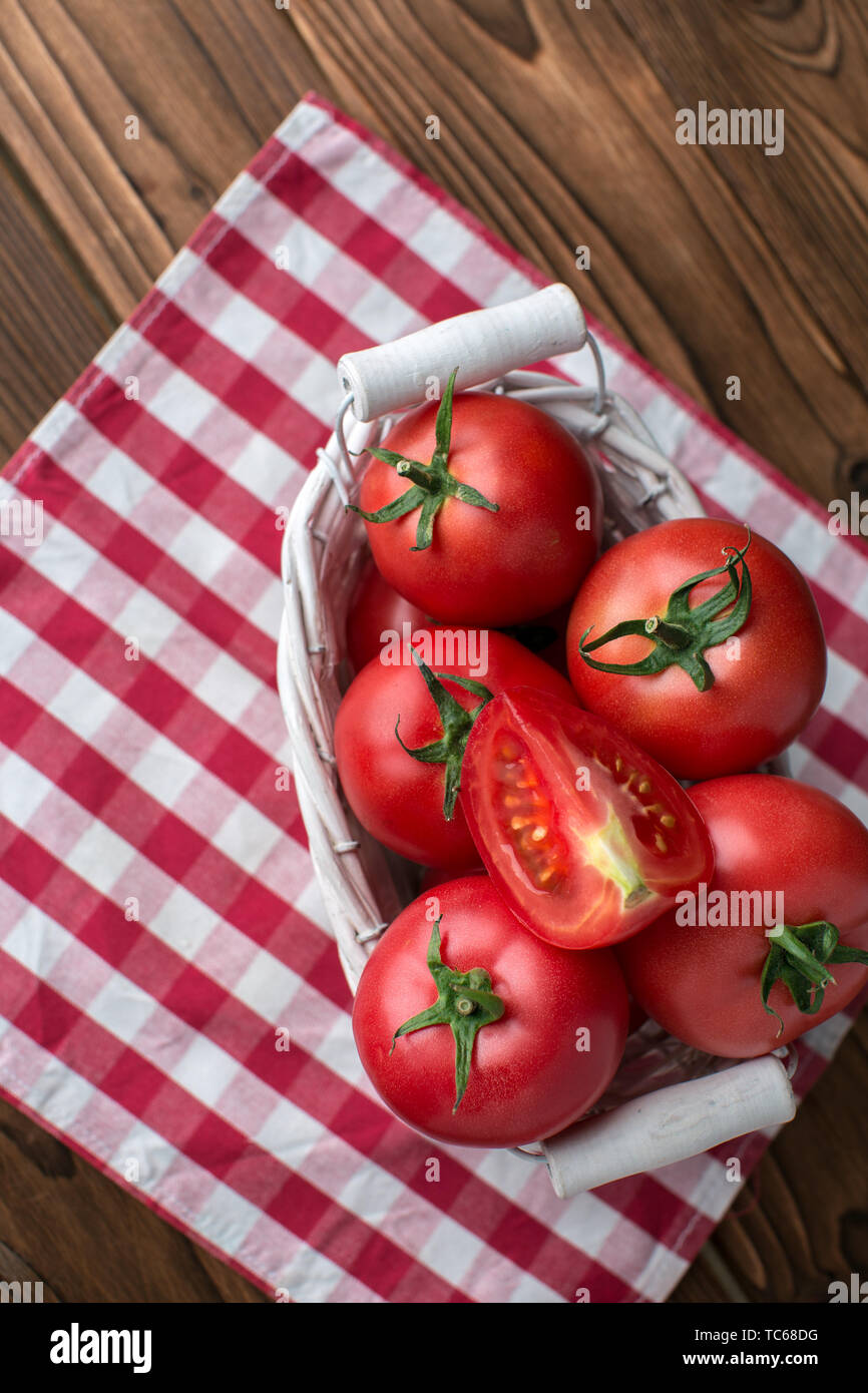 tomatoes on wooden background Stock Photo - Alamy