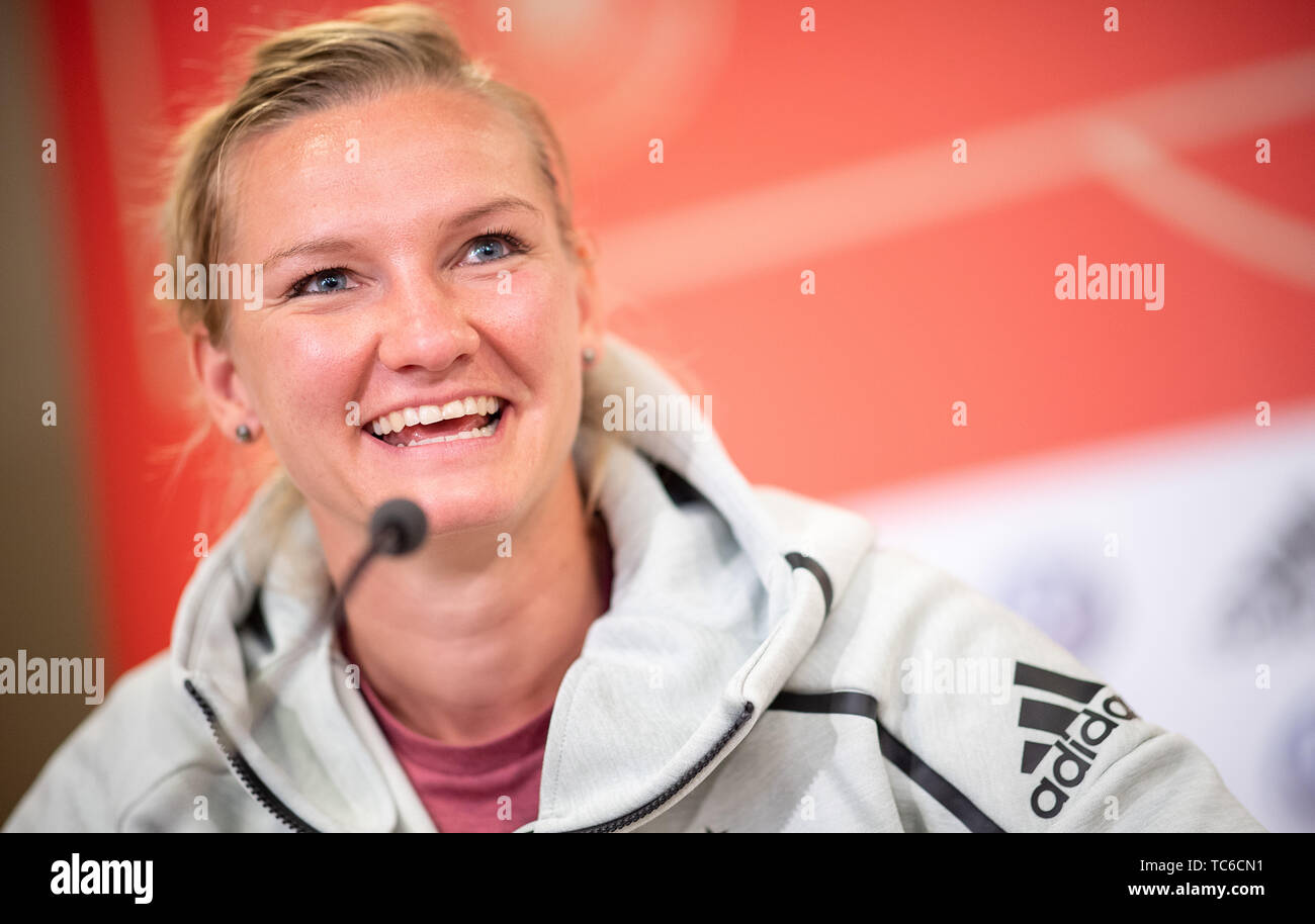05 June 2019, France (France), Bruz: Player Alexandra Popp speaks during a press conference of the German women's national football team before the 2019 FIFA World Cup in France. The first match of the German team will take place on 8 June against China in Rennes. Photo: Sebastian Gollnow/dpa Stock Photo