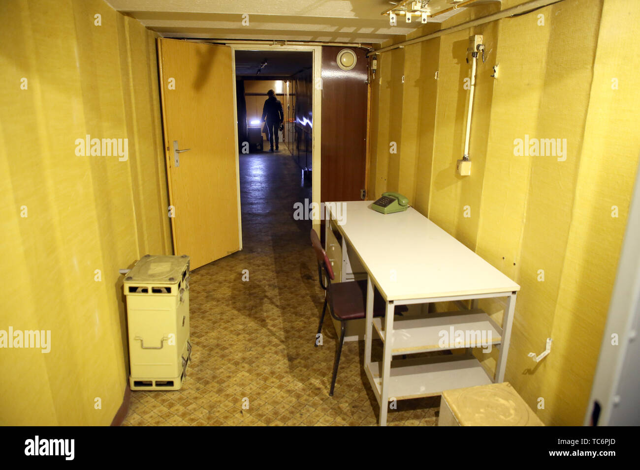 Gosen, Germany. 06th June, 2019. The study of spy boss Markus Wolf in a V2C bunker. In the background the bedroom. Almost 30 years after the fall of the Berlin Wall, a former GDR state security bunker is now becoming the learning site of history. (to 'Stasi bunker hidden under birches and pines - soon guided tours') Credit: Wolfgang Kumm/dpa/Alamy Live News Stock Photo