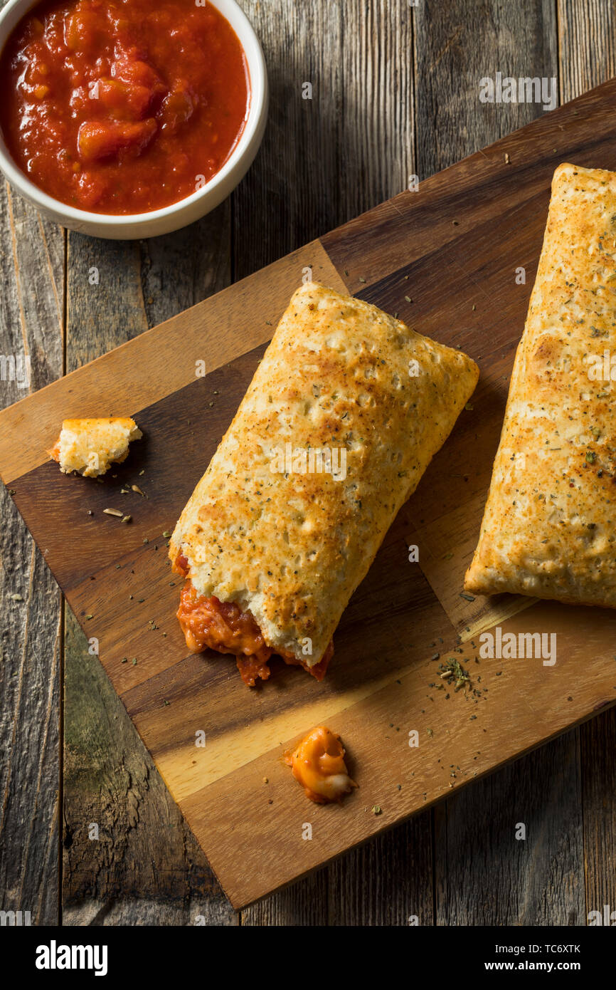Unhealthy Microwaved Pizza Pockets with Cheese and Sauce Stock Photo