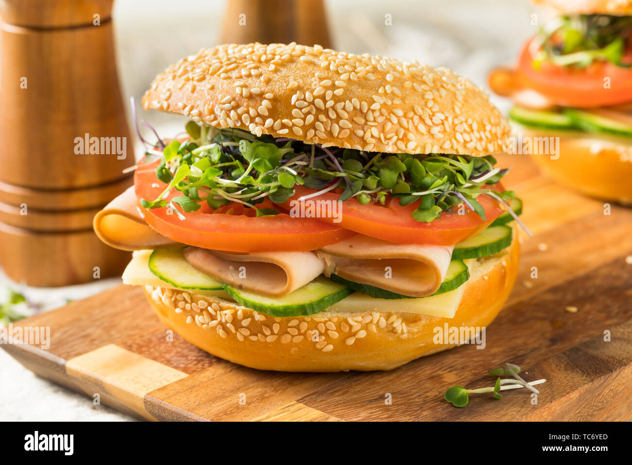 Homemade Bagel Turkey Sandwich with Tomato and Cucumber Stock Photo Alamy