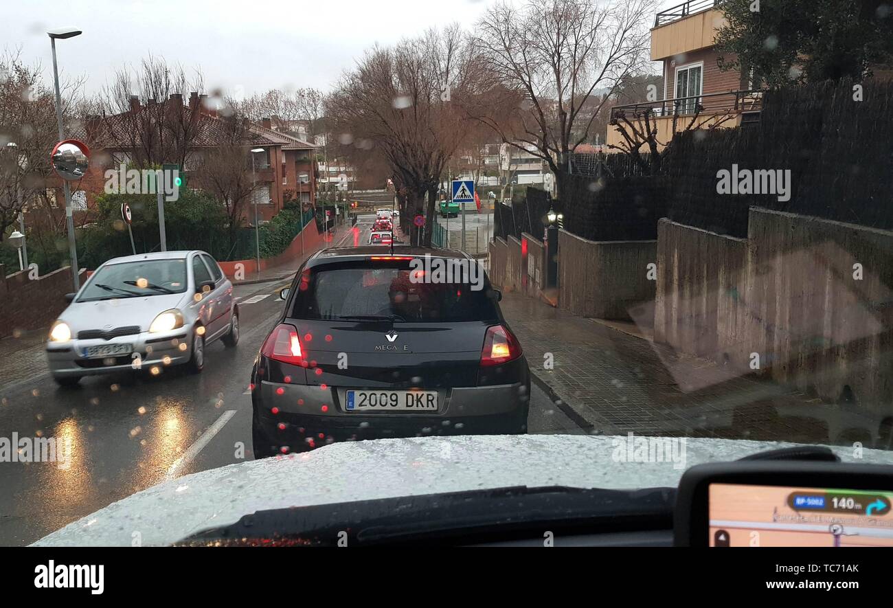 Traffic in a town on a rainy day. El maresme. Barcelona province. Spain Stock Photo