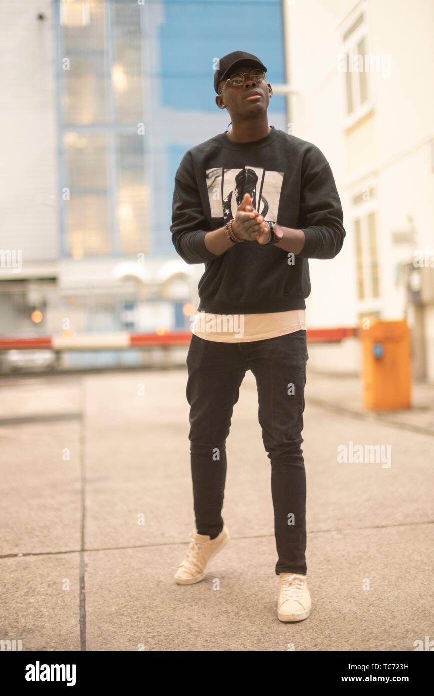 man wearing urban street style clothes, at industrial area in Munich,  Germany Stock Photo - Alamy