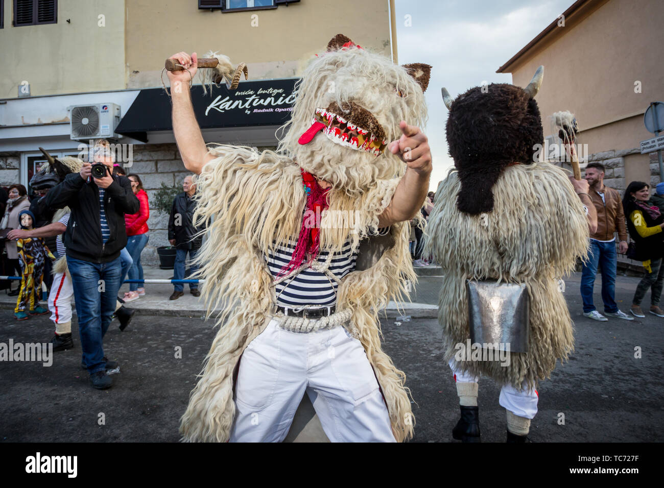 Matulji, Croatia - 3rd February, 2019 : Traditional carnival parade of bellringers with big cattle bells passing thru the street of Matulji, during th Stock Photo