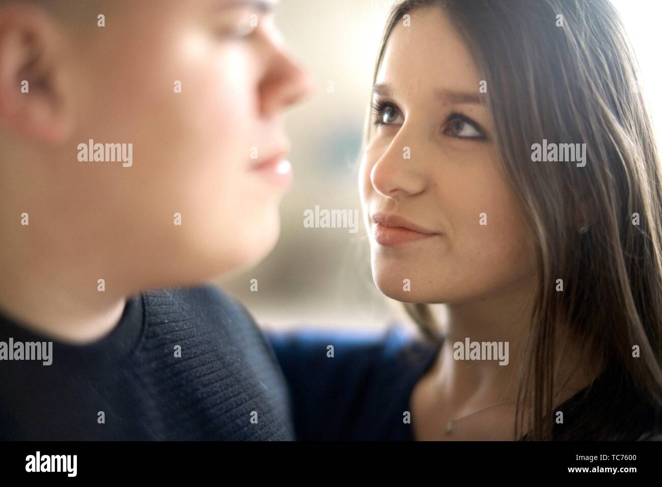 woman looking at man, in Cottbus, Brandenburg, Germany Stock Photo