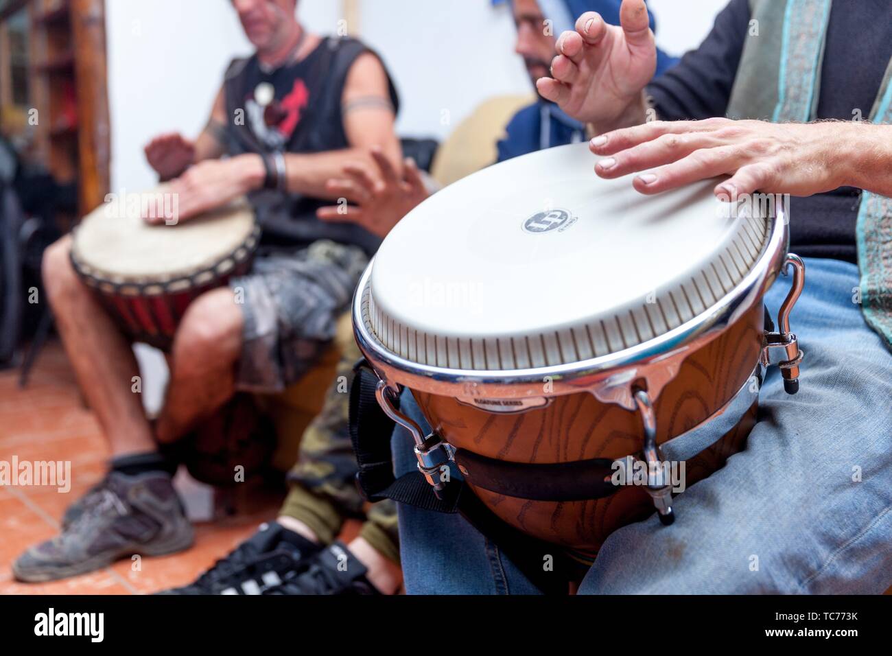musicians playing Bongo drums Stock Photo