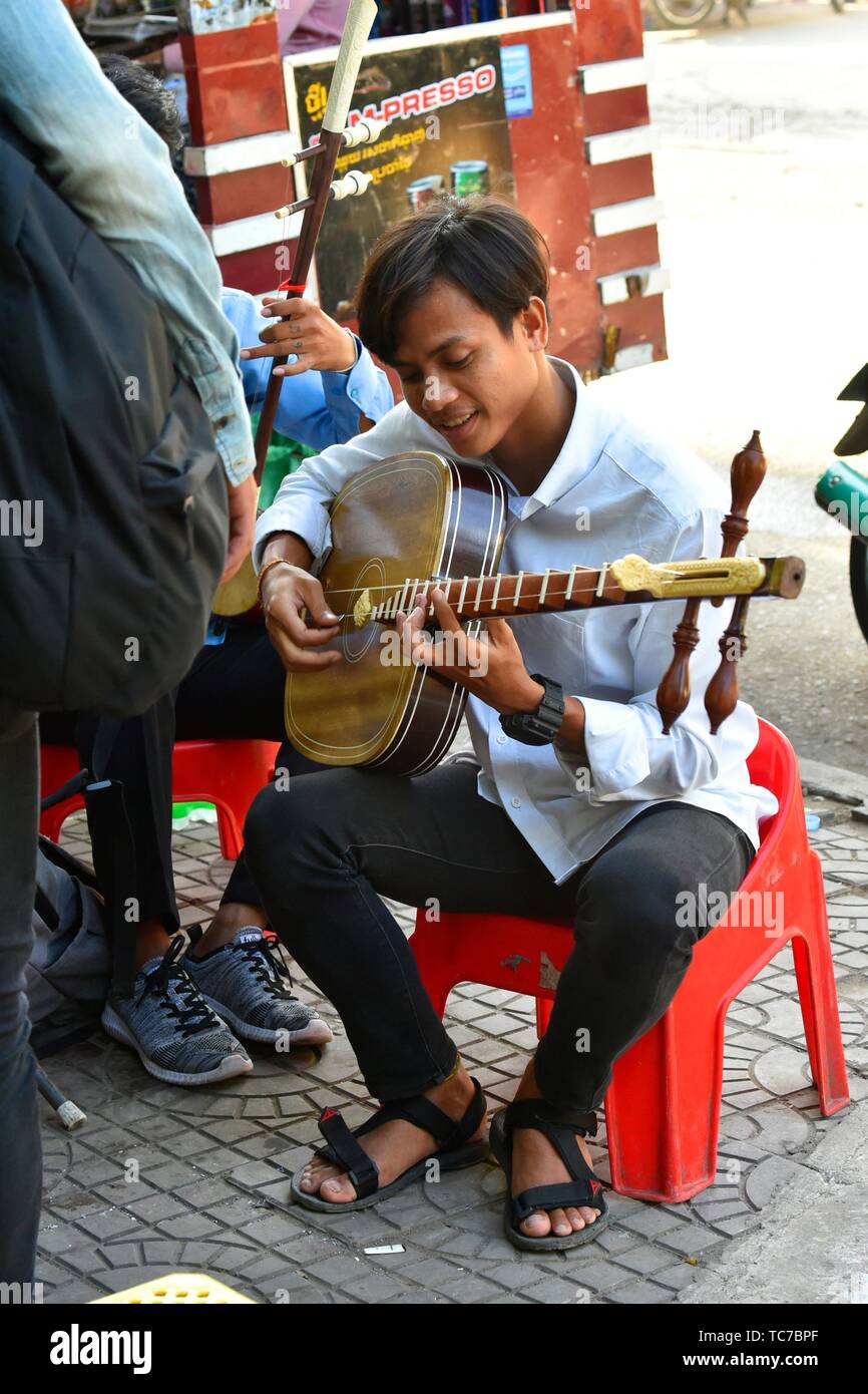Young student playing music in Phnom Penh,Cambodia,South east Asia. Stock Photo