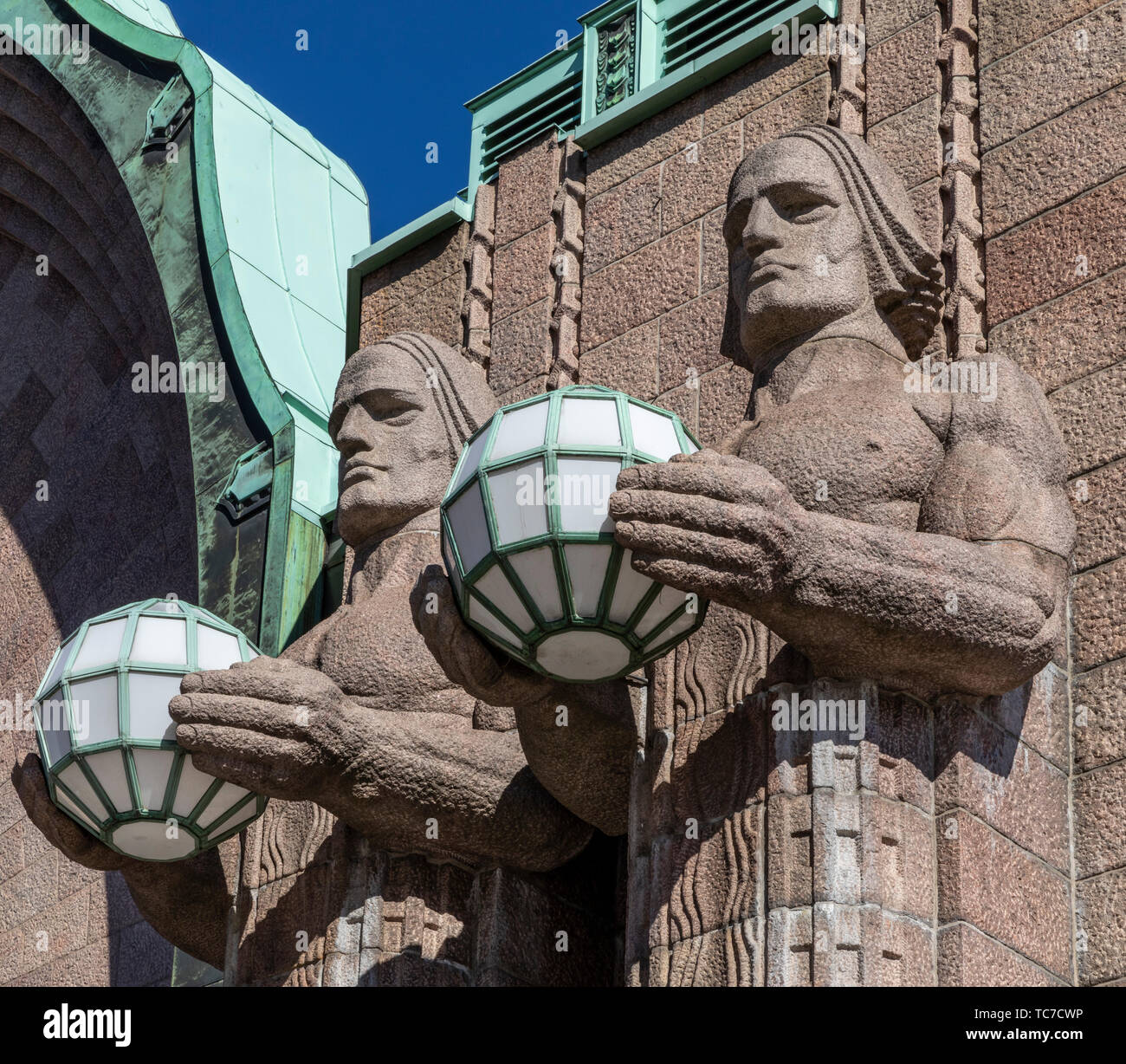 Stone Men Statues at Helsinki Central Railroad Station Stock Photo