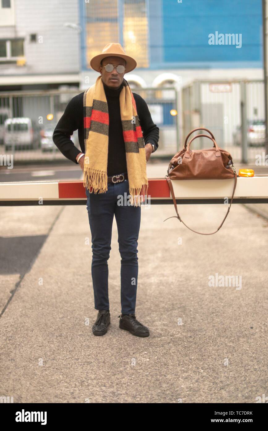 classy man with stylish casual men´s fashion outfit, at barrier at  industrial area in Munich, Germany Stock Photo - Alamy